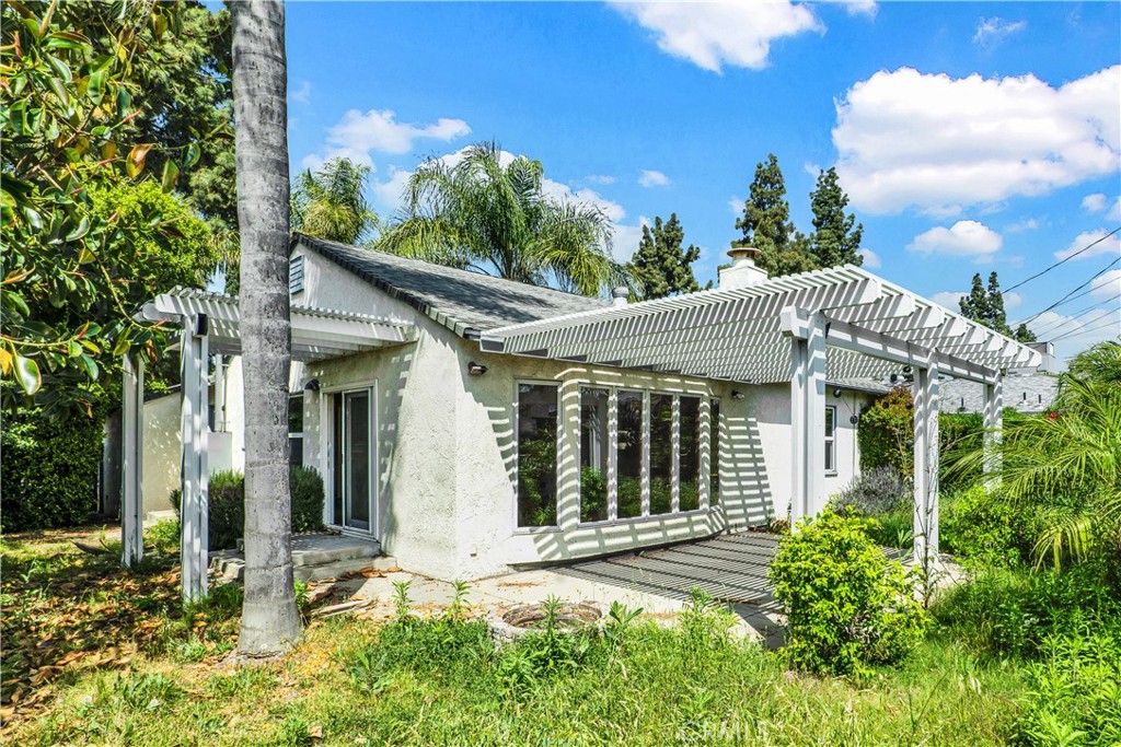 8048 Etiwanda Avenue Reseda, CA 91335 - Photo 15 of 16 front view of a house with a small yard