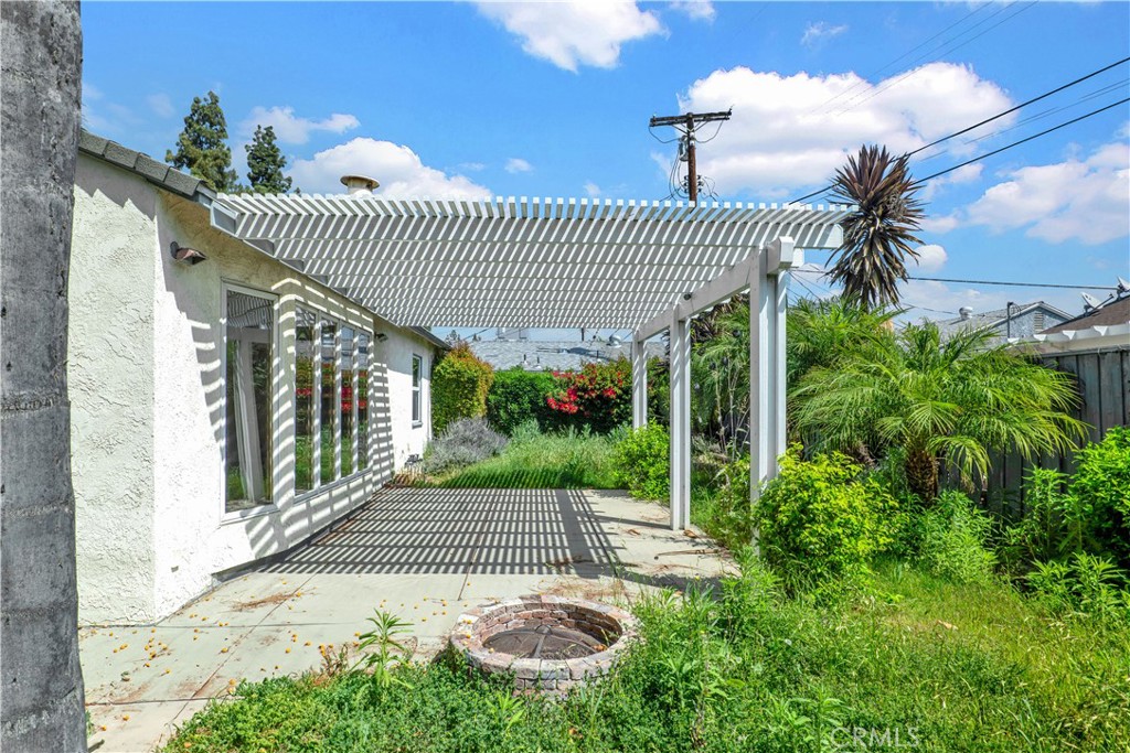 8048 Etiwanda Avenue Reseda, CA 91335 - Photo 16 of 16 a view of a patio with plants and glass door