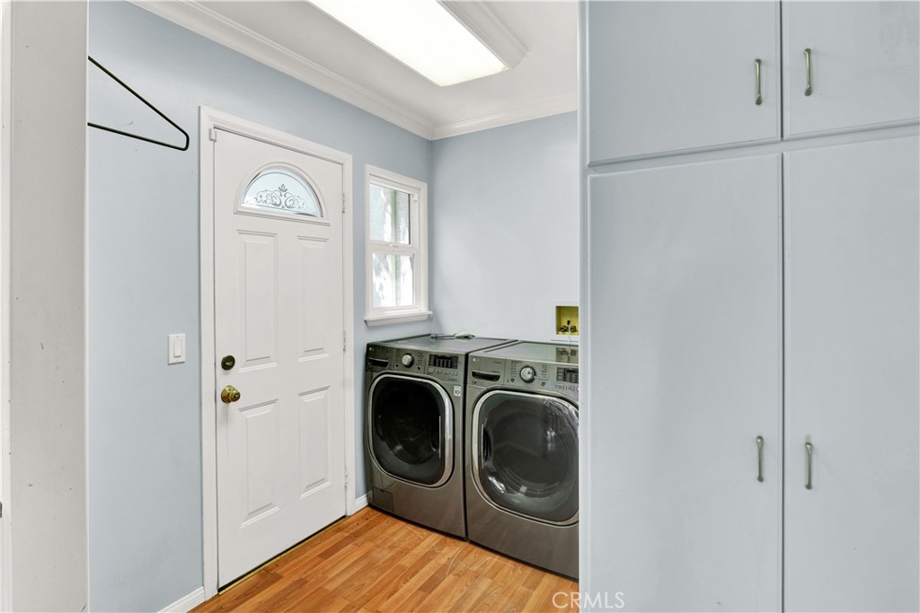 8048 Etiwanda Avenue Reseda, CA 91335 - Photo 8 of 16 a view of a storage and utility room with washer and dryer