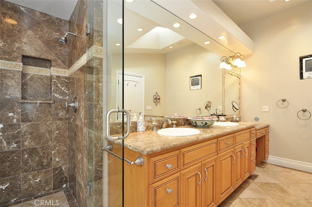 1525 Chelsea Road Palos Verdes Estates, CA 90274 - Photo 14 of 29 a bathroom with a granite countertop sink and a mirror