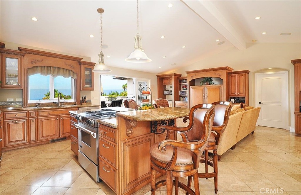 1525 Chelsea Road Palos Verdes Estates, CA 90274 - Photo 8 of 29 a kitchen with stainless steel appliances granite countertop a stove a sink dishwasher and a refrigerator with wooden floor