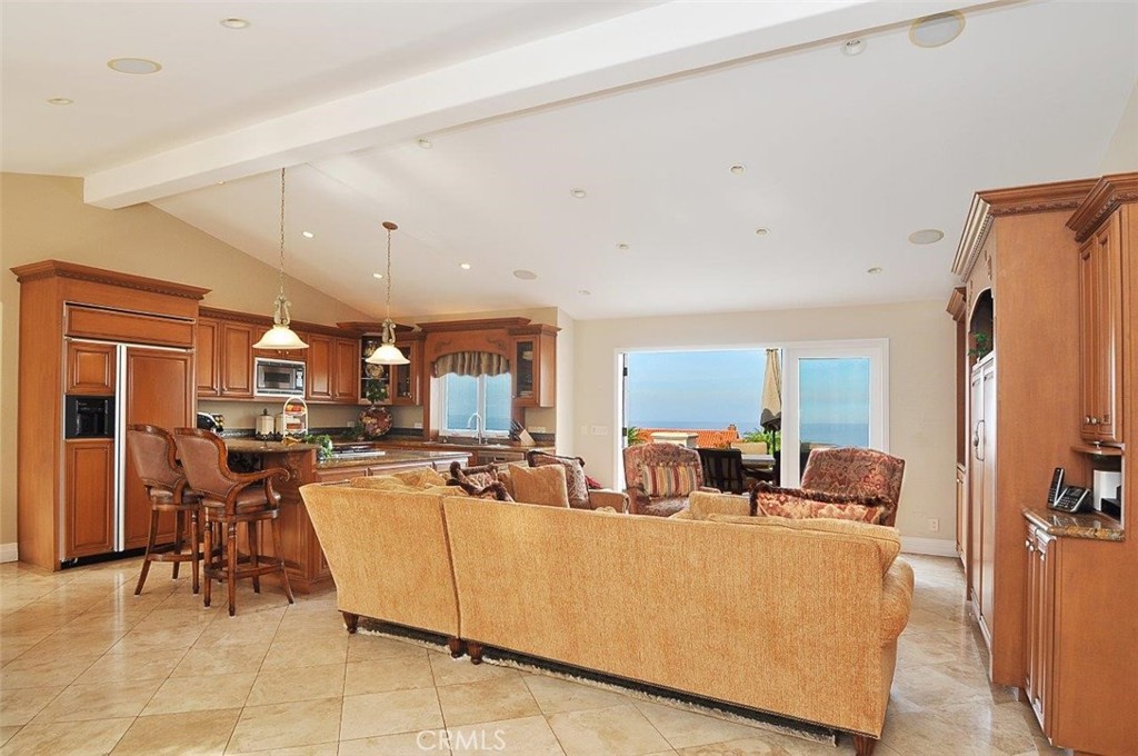 1525 Chelsea Road Palos Verdes Estates, CA 90274 - Photo 9 of 29 a living room with furniture and a flat screen tv