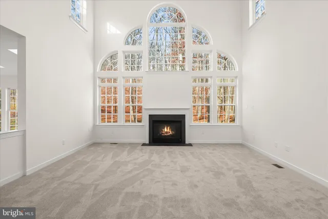 a kitchen with white cabinets stainless steel appliances and a counter space