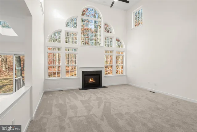 a view of a kitchen with sink cabinets and outdoor space
