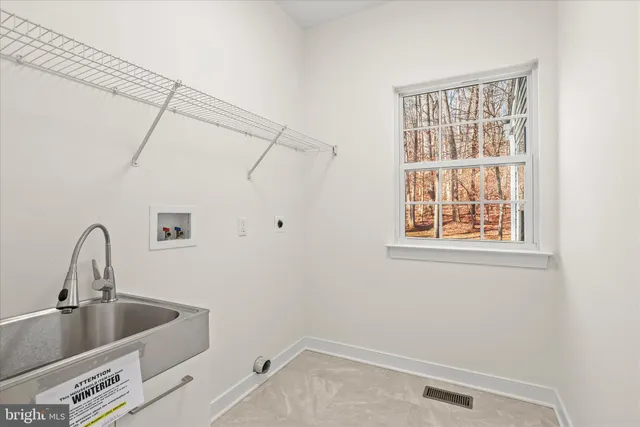 a bathroom with a double vanity sink a mirror and