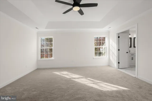 a front view of a house with a garden and yard