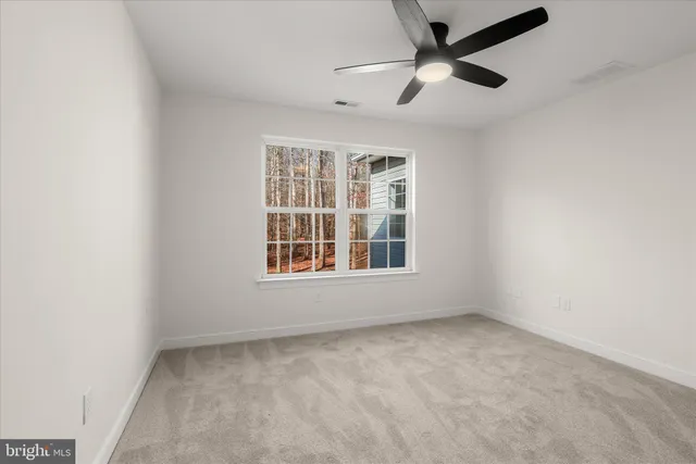 a front view of a house with a yard table and garage
