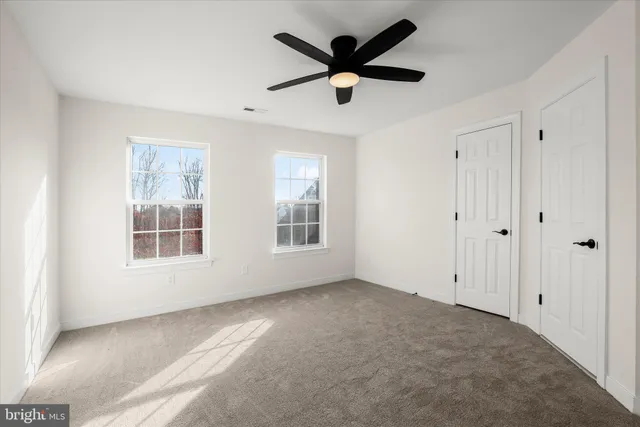 a picture of a bench in front of a window