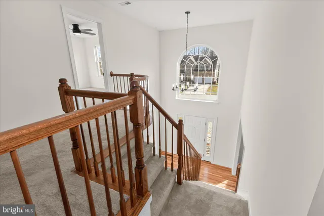 a view of a livingroom with a fireplace and window