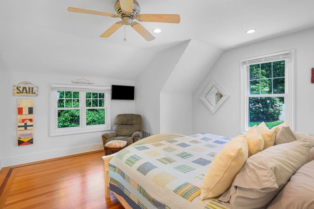 a bathroom with a granite countertop sink a mirror a shower and a bathtub