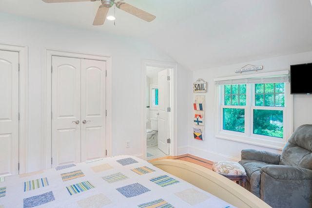 a bedroom with a bed and a couch