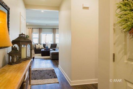 419 Abigail Street Ridgecrest, CA 93555 - Photo 6 of 34 a living room with furniture and a fireplace