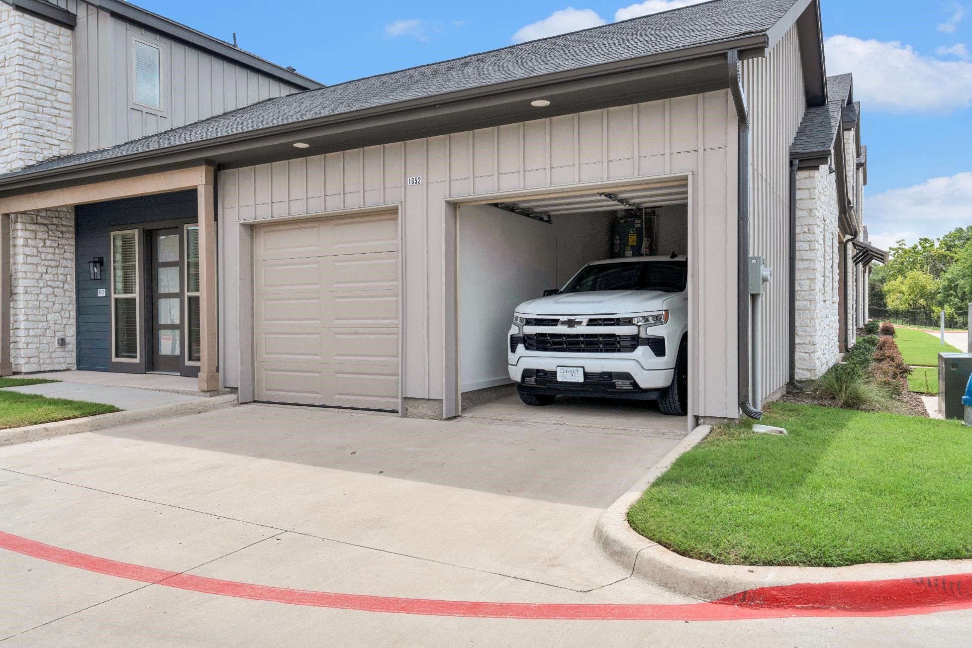 1652-101 Spaniel Avenue Rowlett, TX 75089 - Photo 29 of 41 a view of a car in front of a building