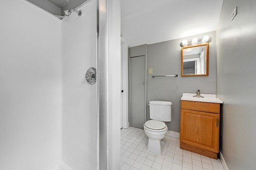 1811 Prairie Street Glenview, IL 60025 - Photo 13 of 22 a bathroom with a toilet and a shower