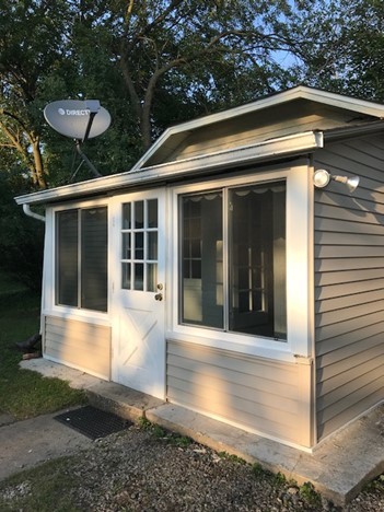 1811 Prairie Street Glenview, IL 60025 - Photo 19 of 22 a view of a house with a large window and yard