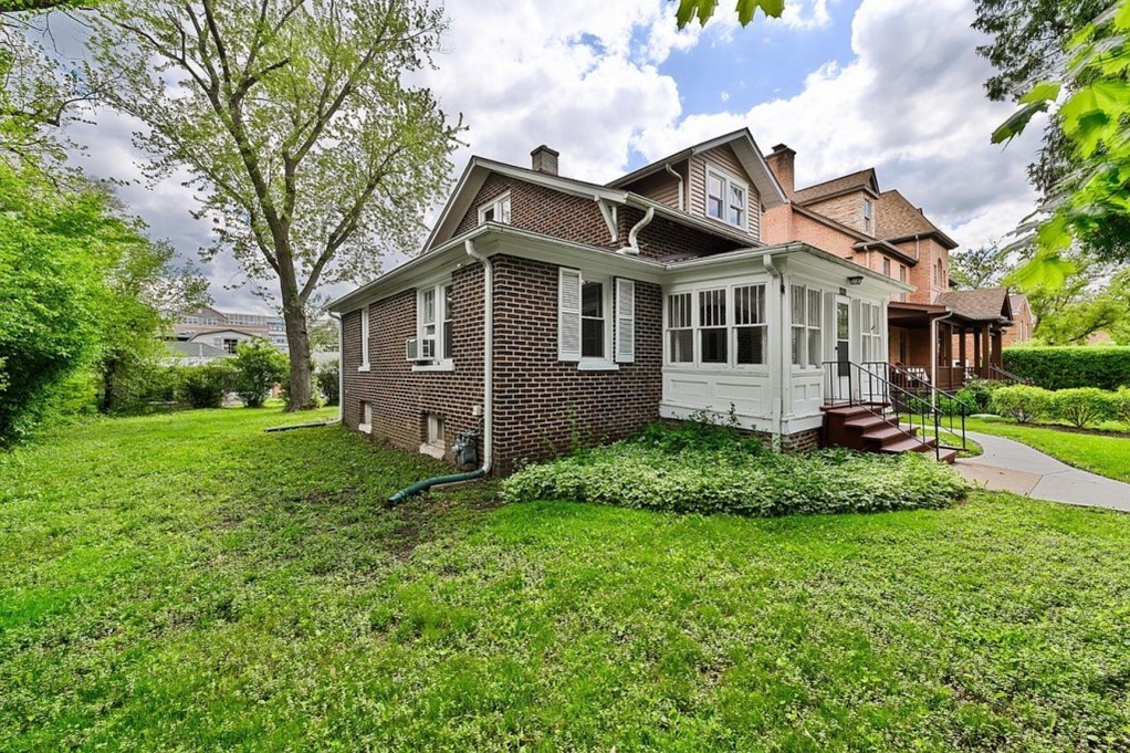 1811 Prairie Street Glenview, IL 60025 - Photo 2 of 22 a front view of a house with a garden