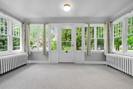1811 Prairie Street Glenview, IL 60025 - Photo 3 of 22 a view of an empty room with windows and a balcony