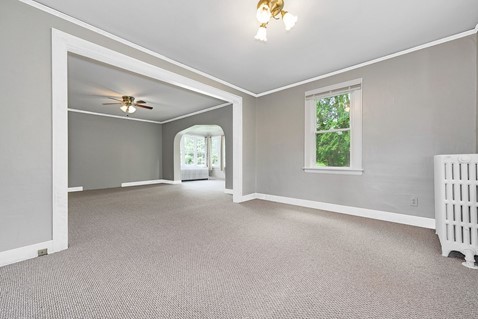 1811 Prairie Street Glenview, IL 60025 - Photo 5 of 22 an empty room with windows and chandelier