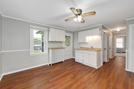 1811 Prairie Street Glenview, IL 60025 - Photo 8 of 22 a kitchen with a refrigerator and white cabinets