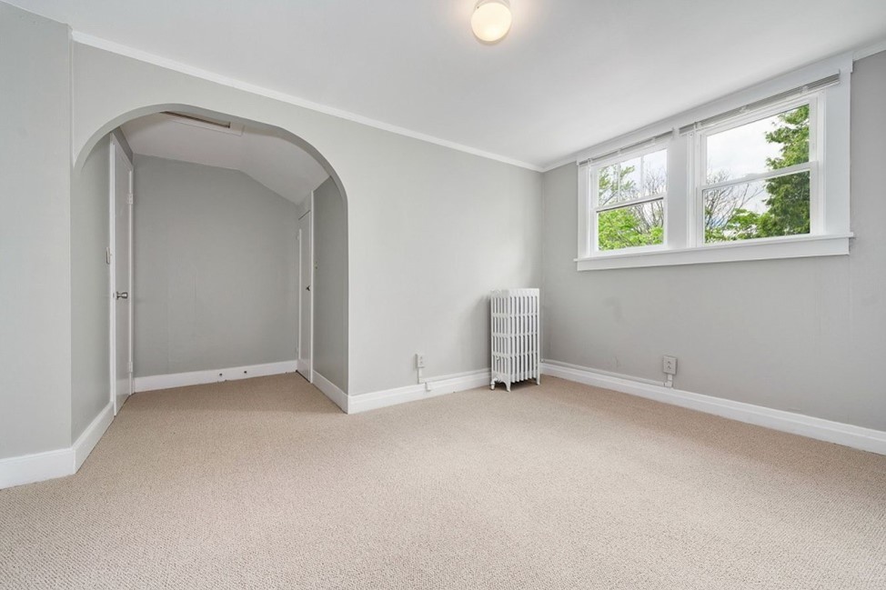 1811 Prairie Street Glenview, IL 60025 - Photo 9 of 22 an empty room with windows and closet