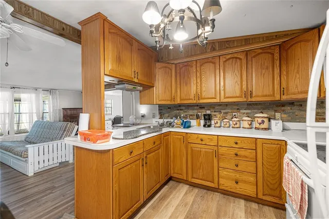 a bathroom with a sink a toilet and shower curtain