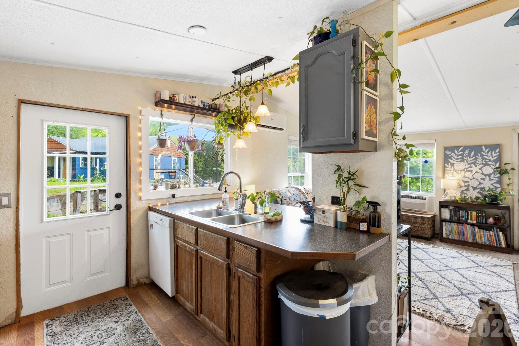 4 Mountain View Road Asheville, NC 28806 - Photo 21 of 35 a kitchen with a sink a stove and chairs