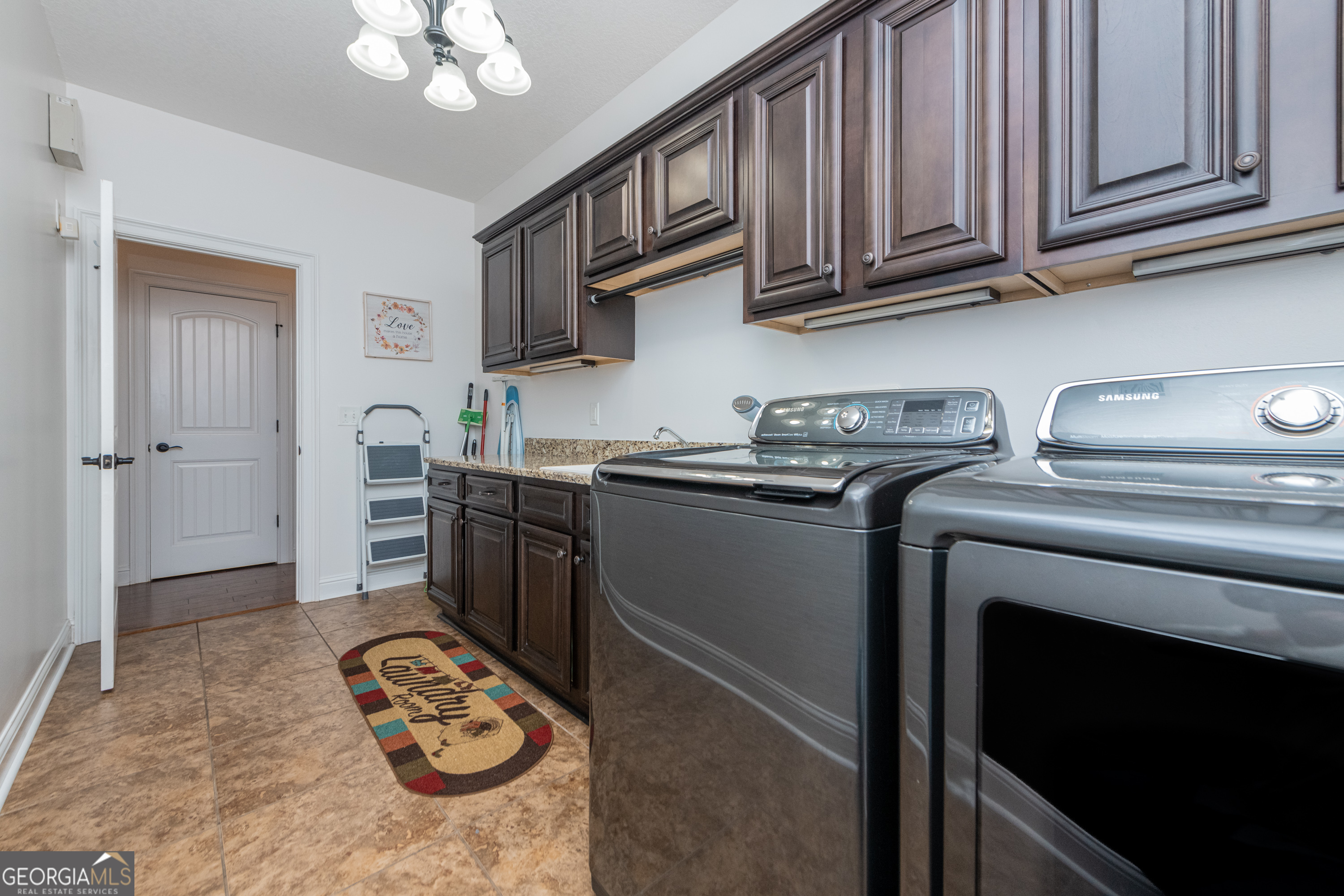 405 Old Bridge Road Warner Robins, GA 31088 - Photo 26 of 55 a kitchen with stainless steel appliances granite countertop a sink stove and cabinets
