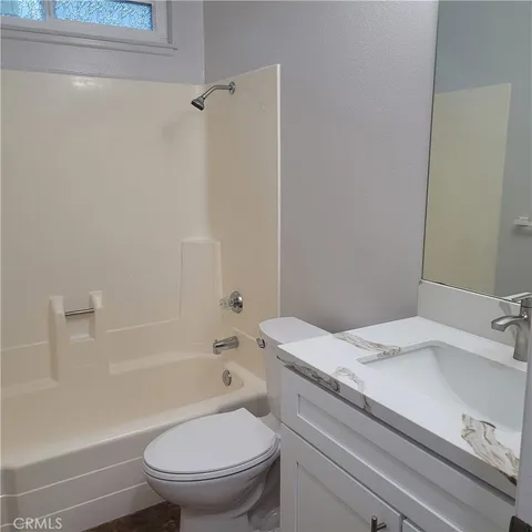 a bathroom with a sink a toilet and a bathtub