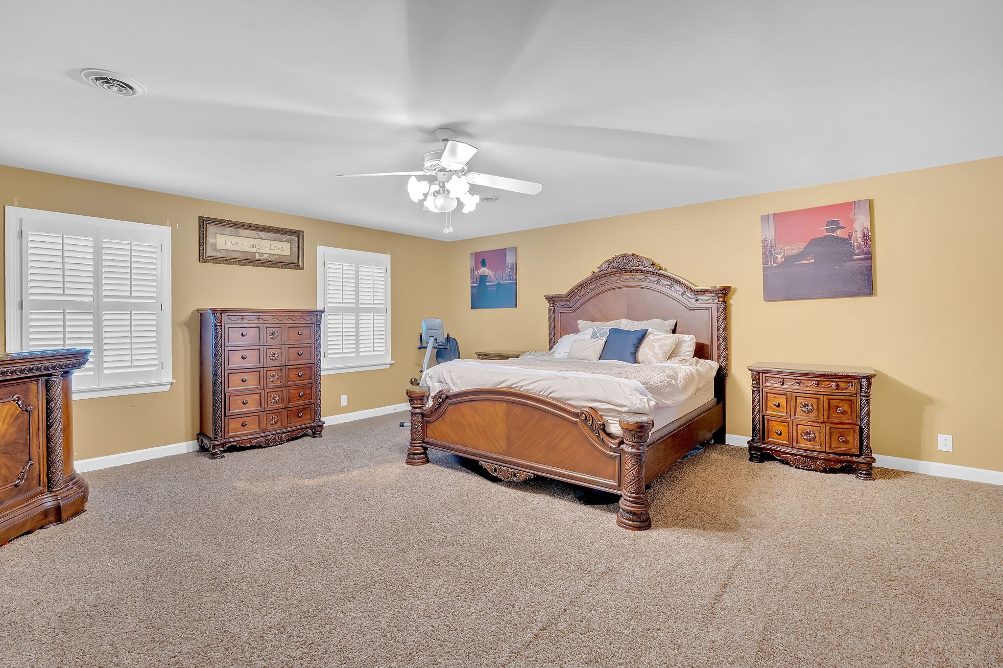 2115 Battleground Drive Murfreesboro, TN 37129 - Photo 27 of 40 a spacious bedroom with a bed a dresser and potted plant on the dresser