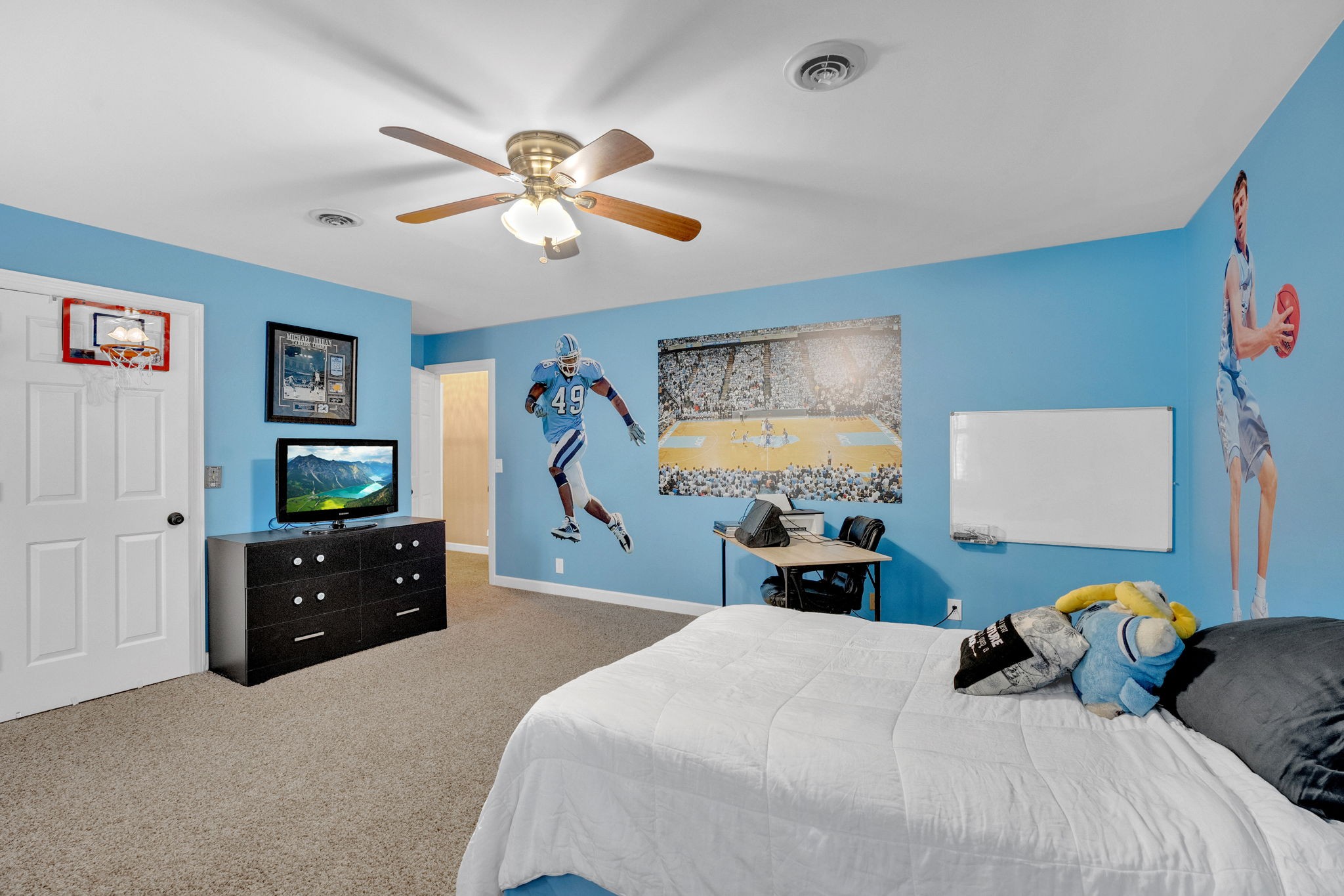 2115 Battleground Drive Murfreesboro, TN 37129 - Photo 31 of 40 a bedroom with a bed and a chandelier