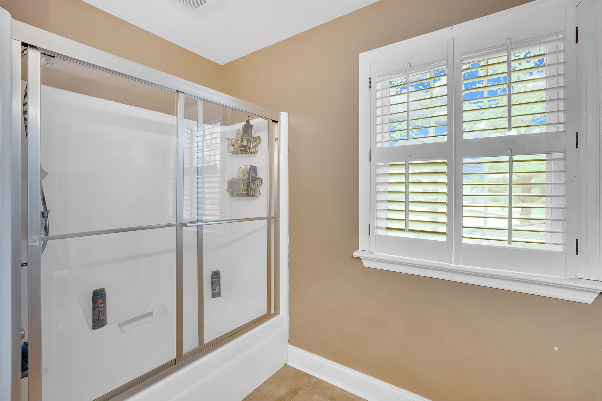 2115 Battleground Drive Murfreesboro, TN 37129 - Photo 33 of 40 a white cabinet sitting in a bathroom next to a window