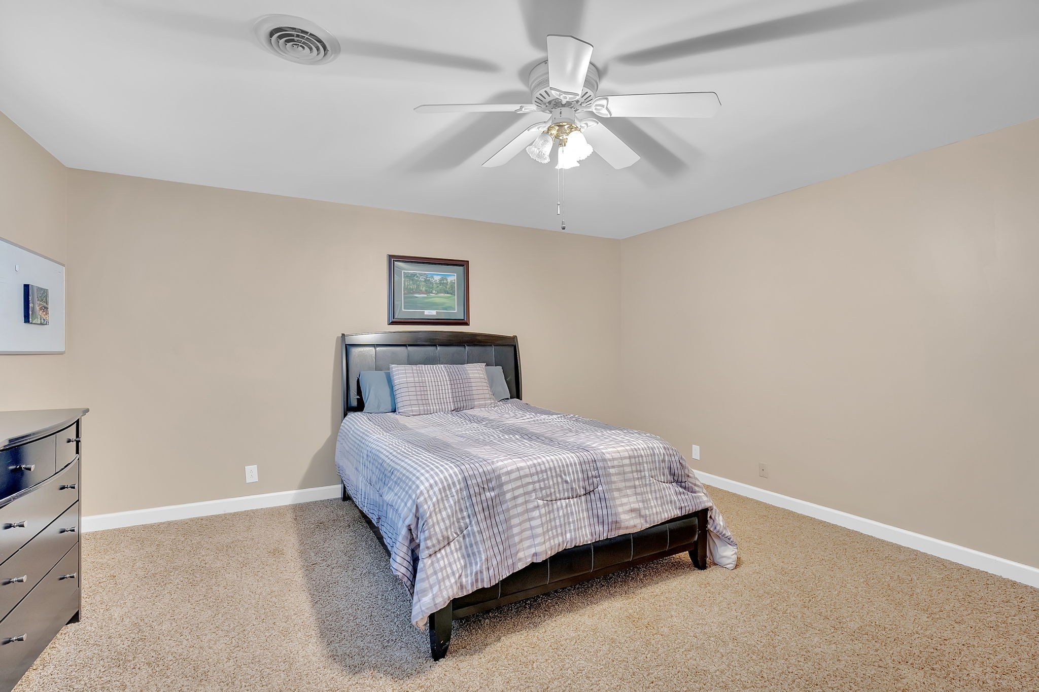 2115 Battleground Drive Murfreesboro, TN 37129 - Photo 35 of 40 a bedroom with a bed and a chandelier