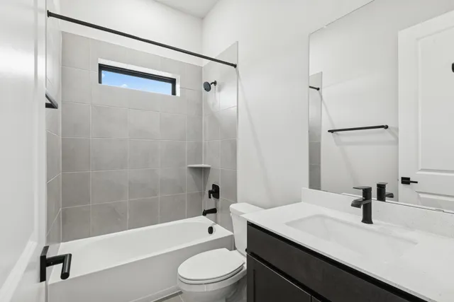 a bathroom with a sink a toilet and a bathtub