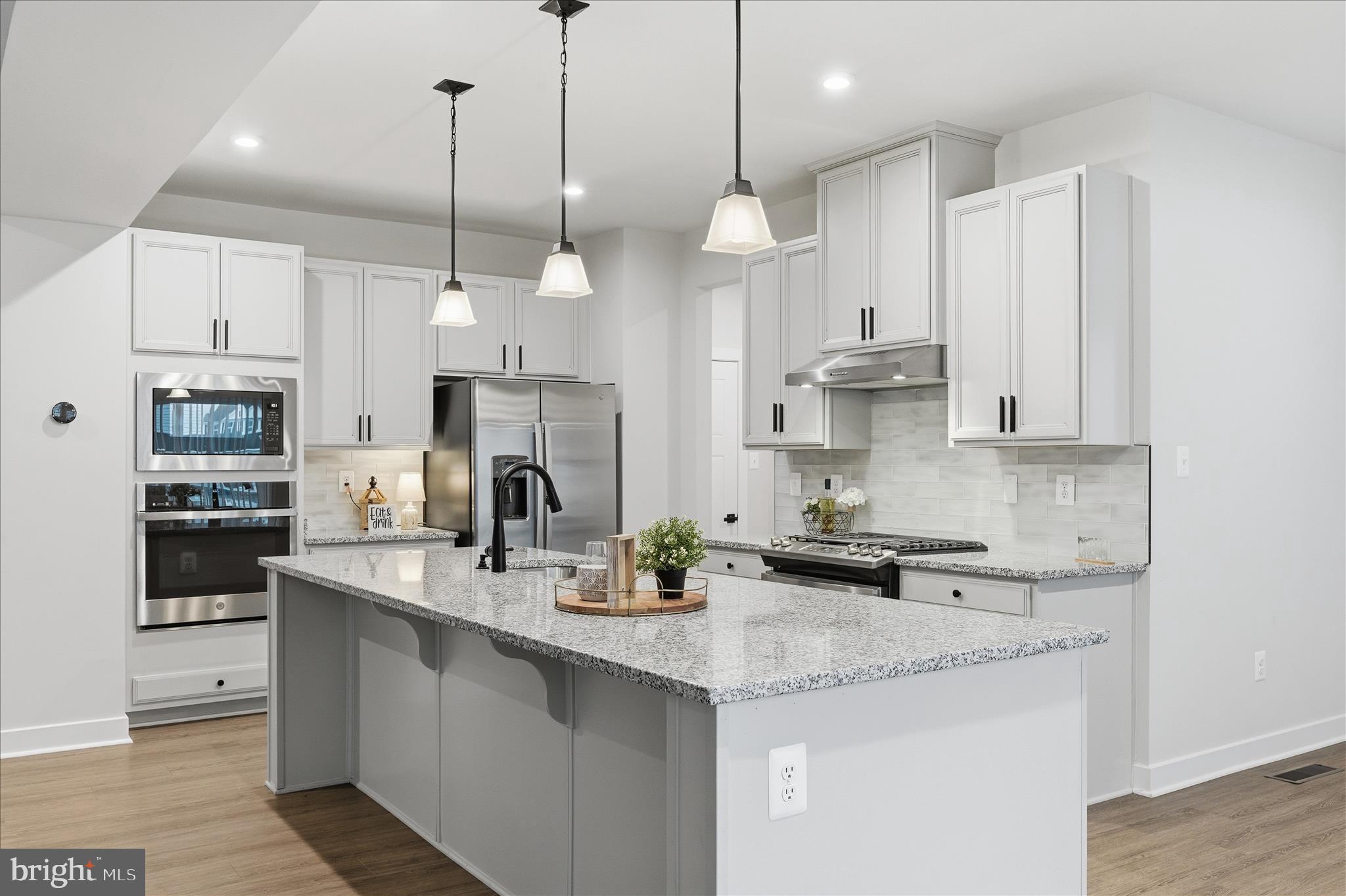 516 Rushbrook Road Martinsburg, WV 25403 - Photo 2 of 86 a kitchen with stainless steel appliances kitchen island granite countertop a sink a stove a refrigerator a center island a stove and cabinets