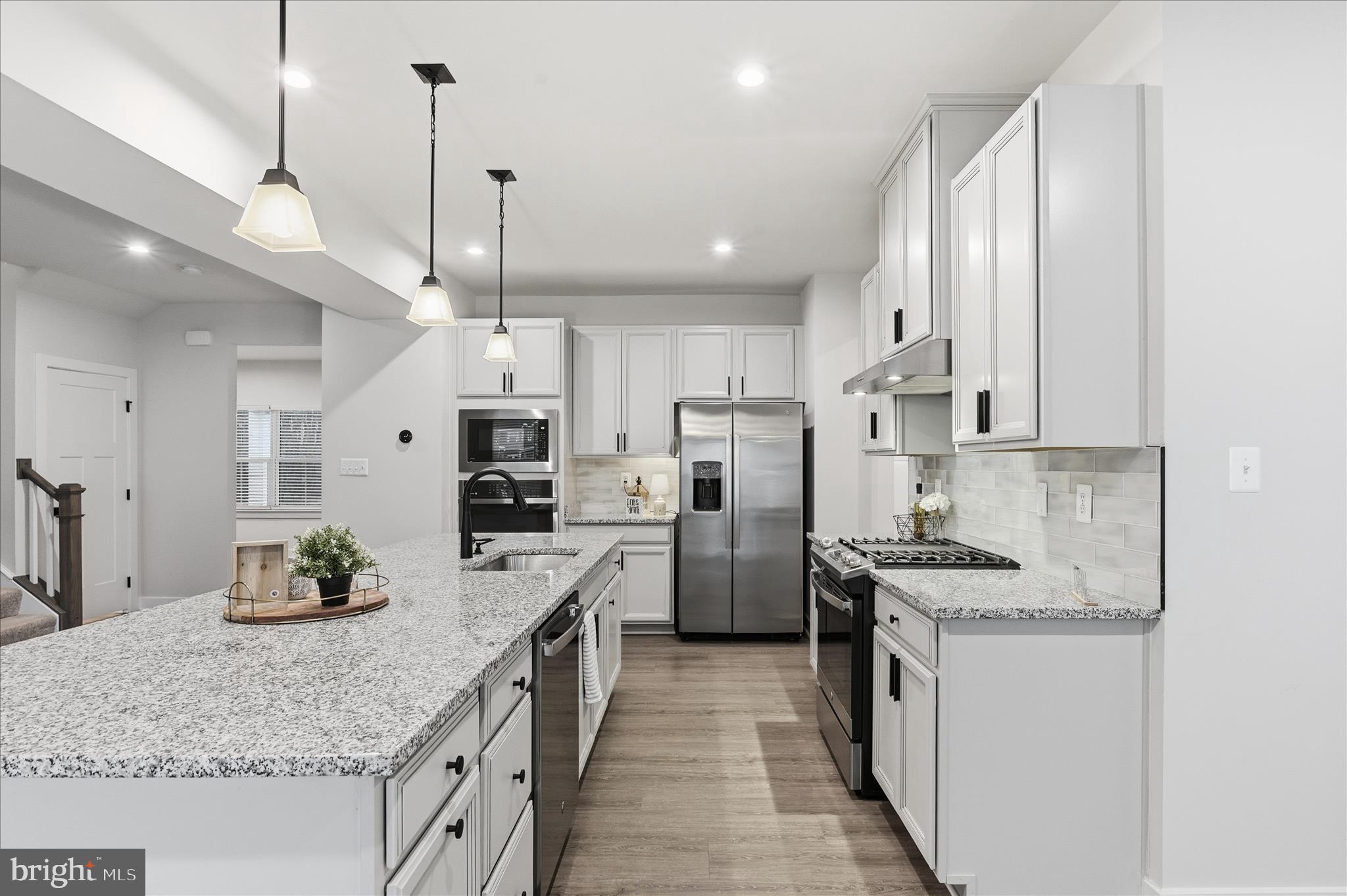 516 Rushbrook Road Martinsburg, WV 25403 - Photo 24 of 86 a kitchen with stainless steel appliances kitchen island granite countertop a sink stove and refrigerator