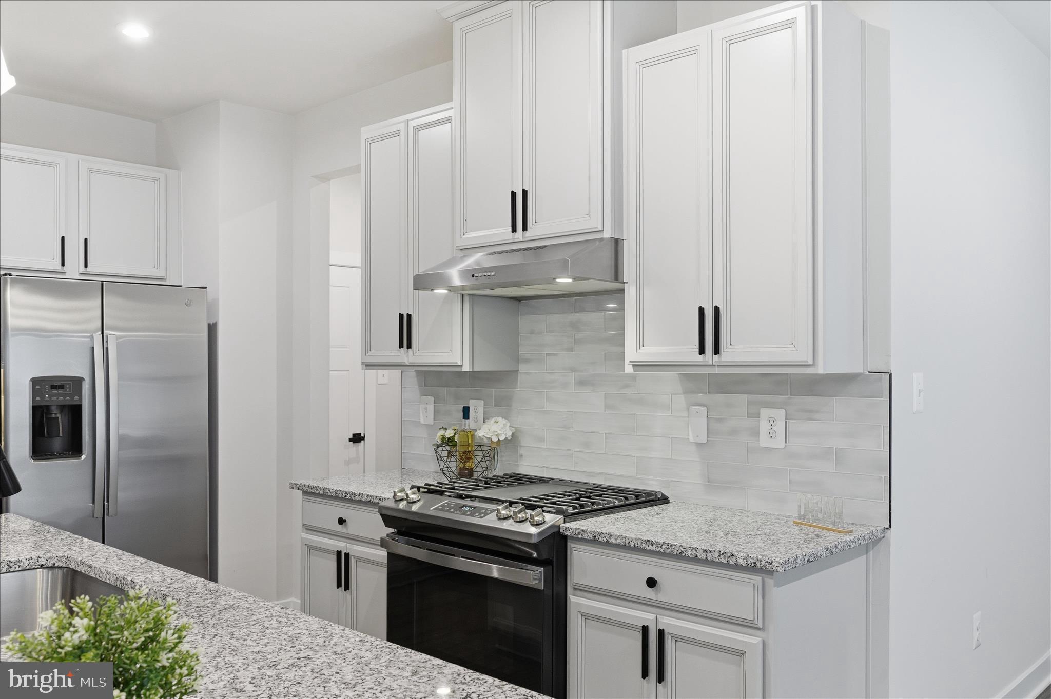 516 Rushbrook Road Martinsburg, WV 25403 - Photo 26 of 86 a kitchen with stainless steel appliances granite countertop a stove and a refrigerator