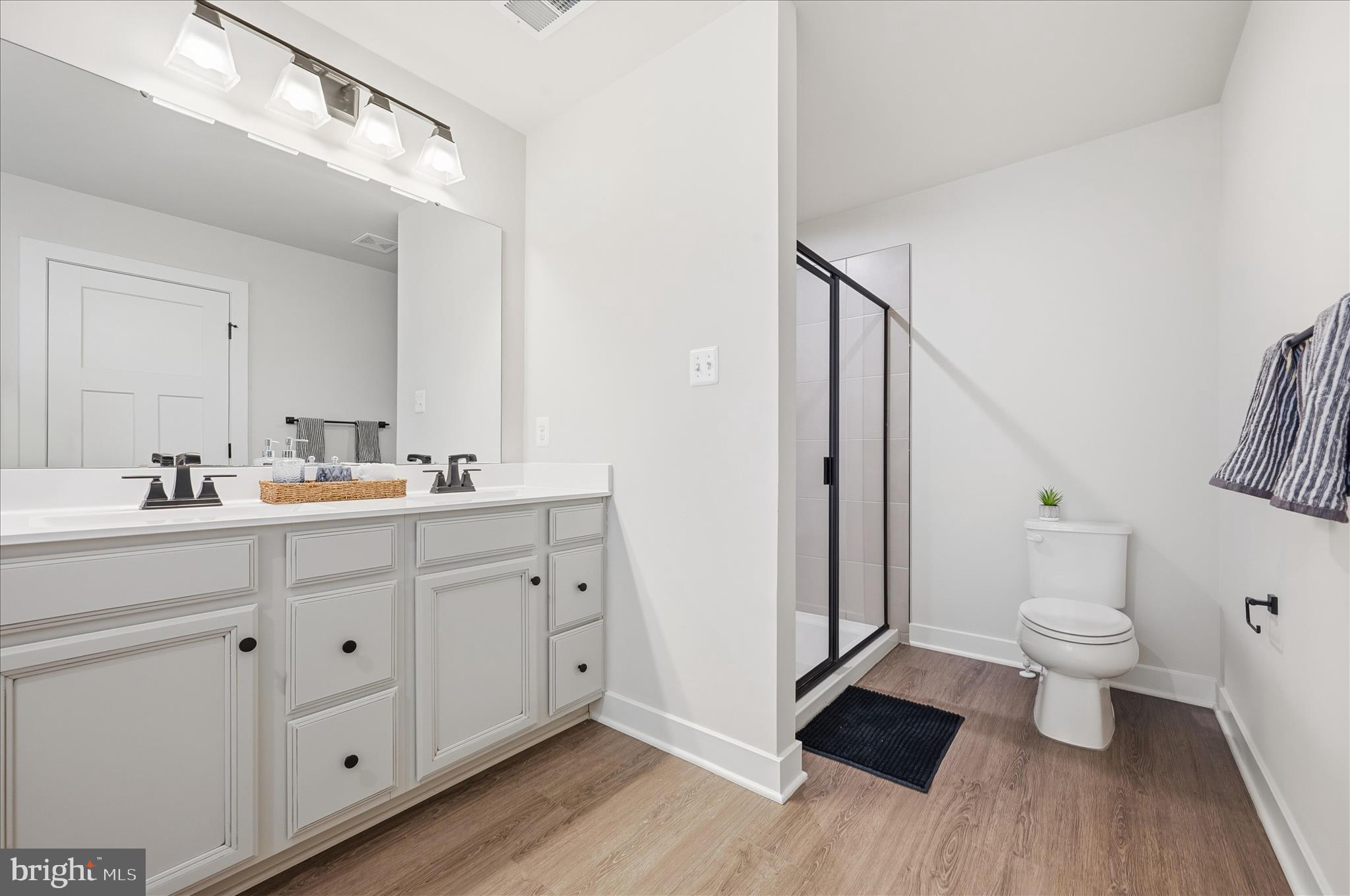 516 Rushbrook Road Martinsburg, WV 25403 - Photo 41 of 86 a bathroom with a double vanity sink toilet and mirror