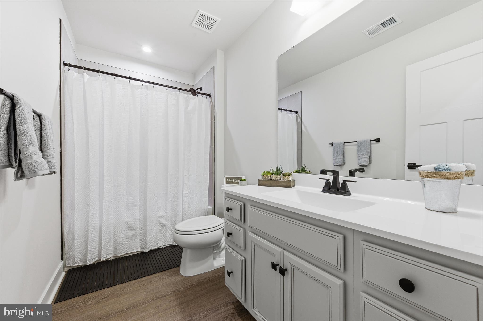516 Rushbrook Road Martinsburg, WV 25403 - Photo 44 of 86 a bathroom with a double vanity sink toilet and a mirror