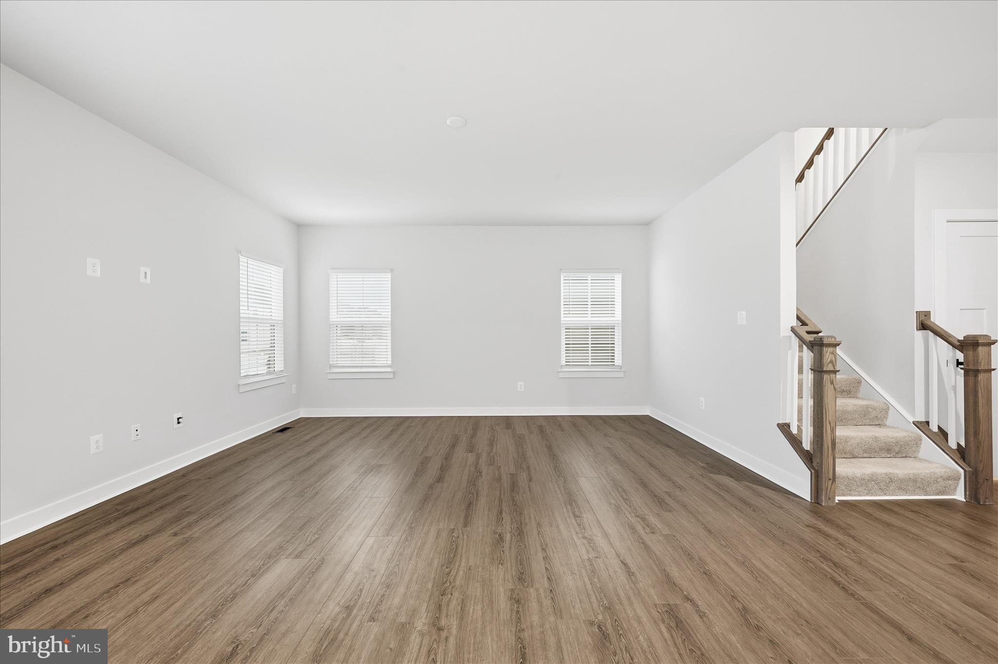516 Rushbrook Road Martinsburg, WV 25403 - Photo 7 of 86 an empty room with wooden floor and window