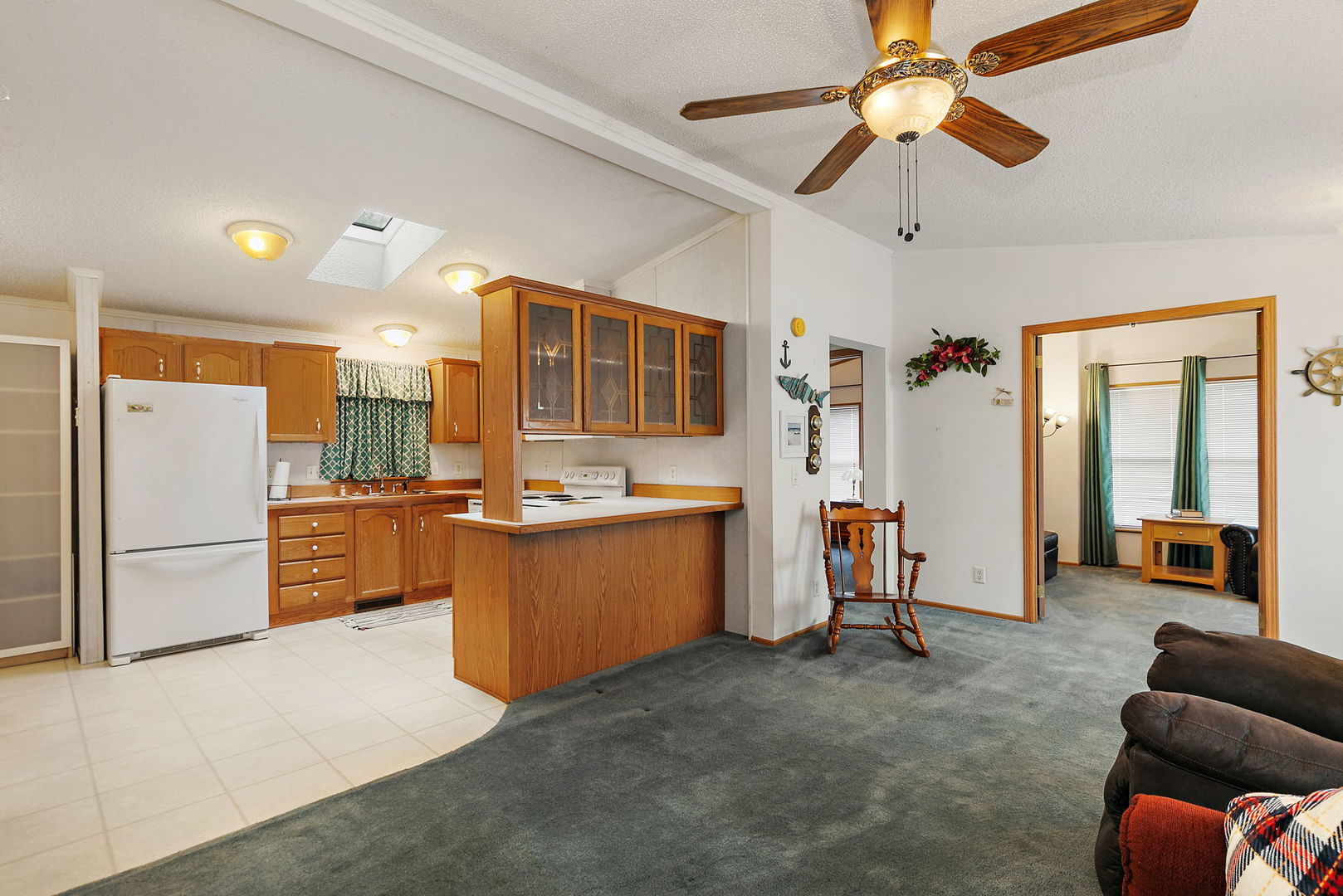 117 Parkwood Road Elgin, IL 60123 - Photo 6 of 16 a kitchen with stainless steel appliances kitchen island granite countertop a refrigerator and a stove top oven