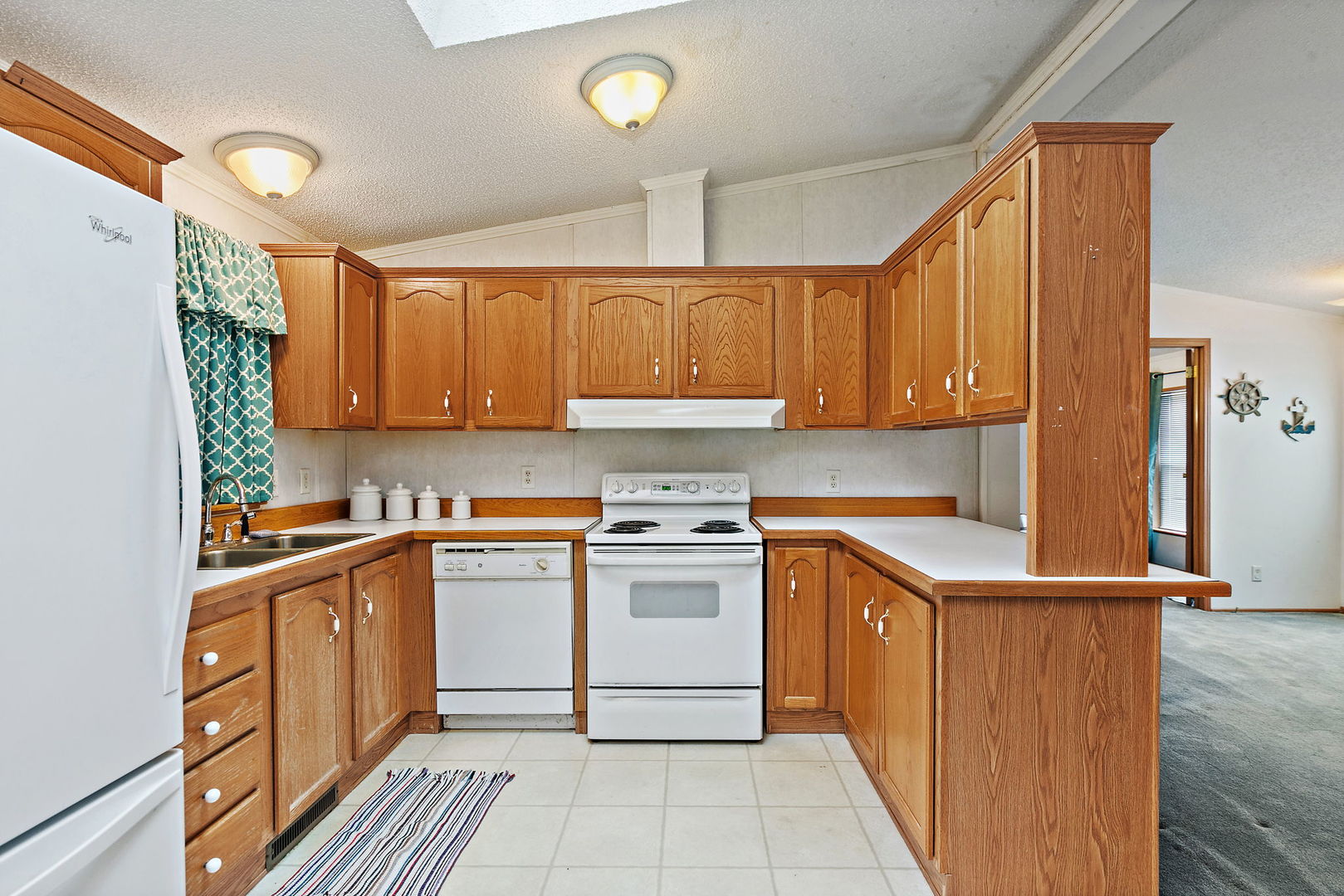 117 Parkwood Road Elgin, IL 60123 - Photo 8 of 16 a kitchen with stainless steel appliances granite countertop a sink stove and refrigerator