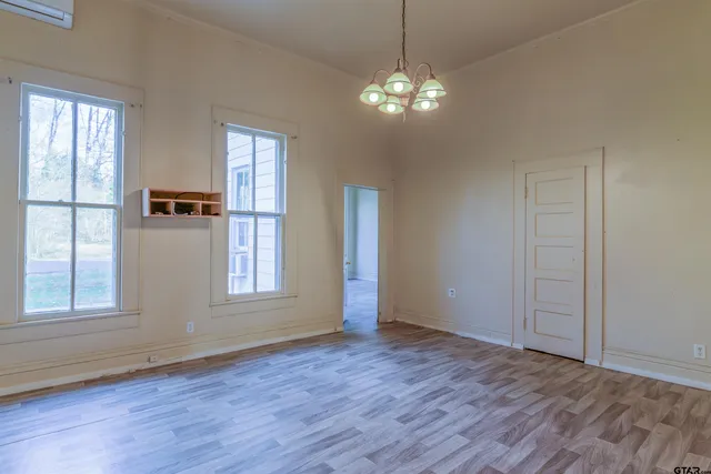 a kitchen with stainless steel appliances granite countertop cabinets and wooden floor