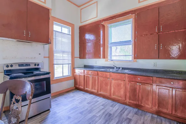 a bathroom with a toilet a sink and a mirror