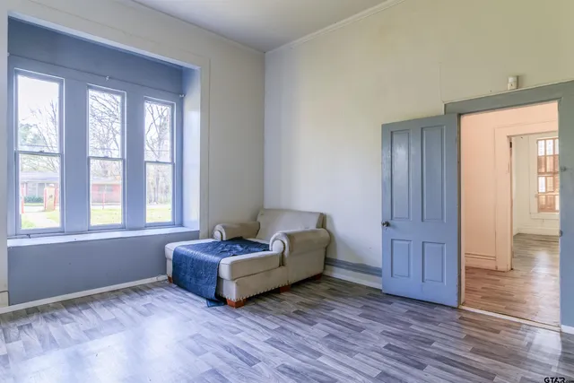 a living room with furniture and windows