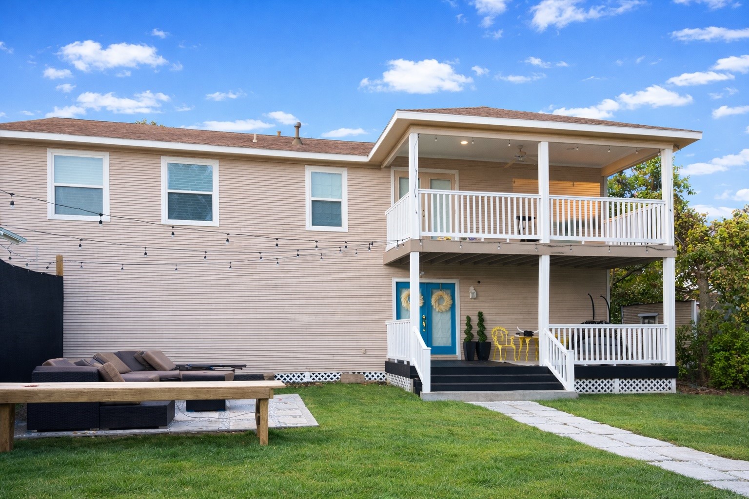 a front view of a house with a garden