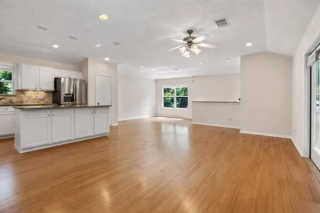 a view of a kitchen with microwave and cabinets