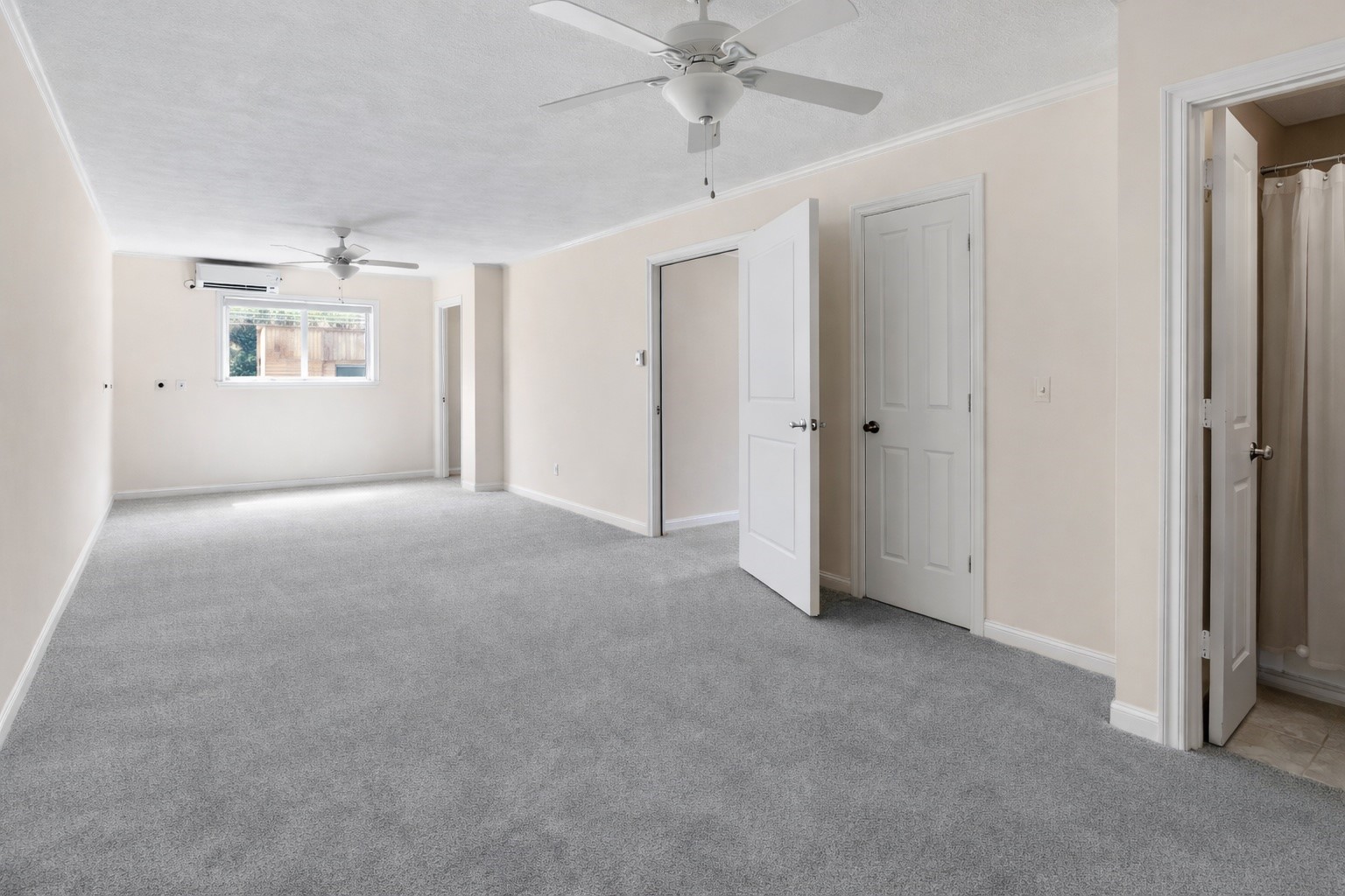 603 Granberry Street Humble, TX 77338 - Photo 10 of 16 an empty room with windows and ceiling fan