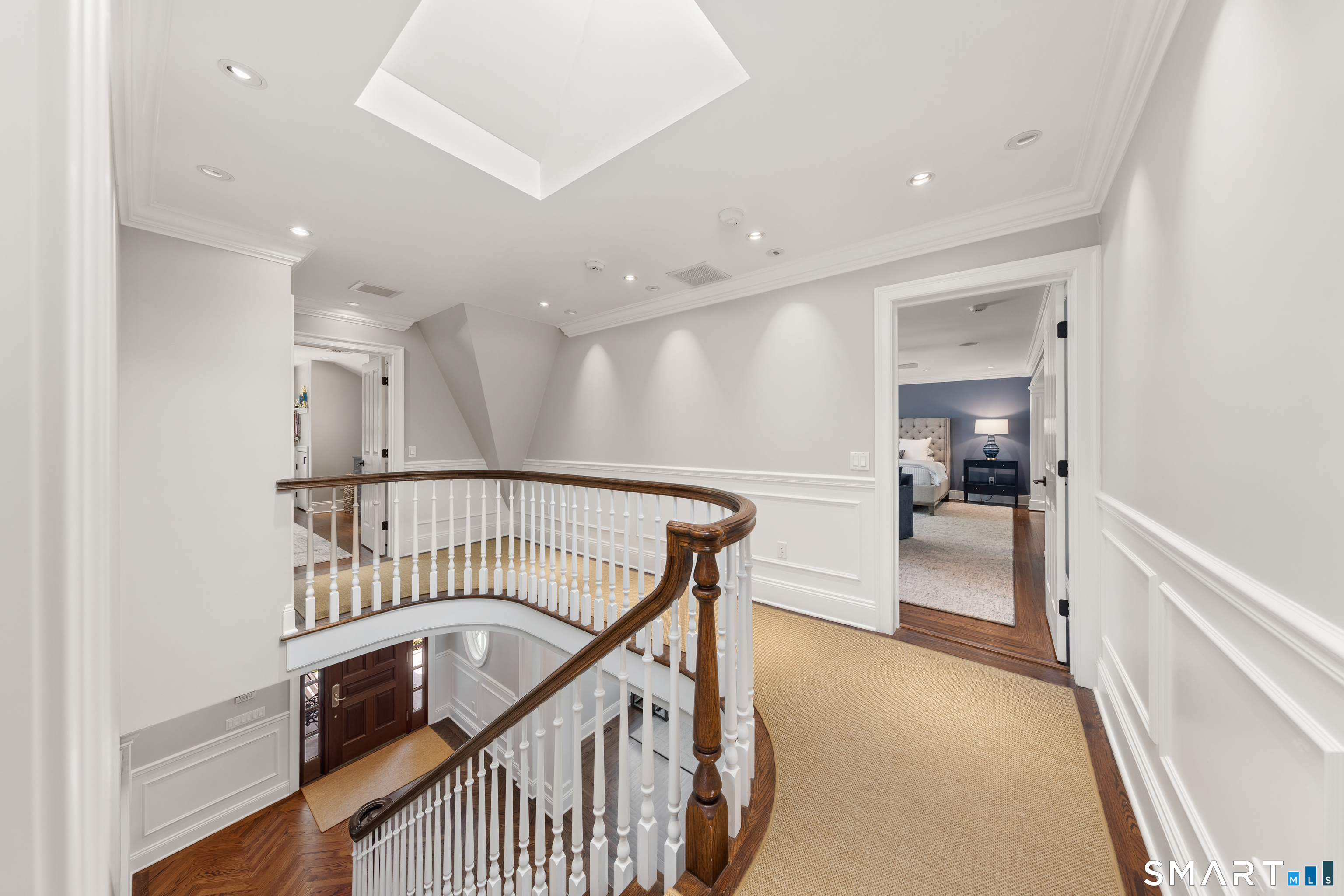 99 Hickok Road New Canaan, CT 06840 - Photo 15 of 39 a view of a hallway with dining room and stairs