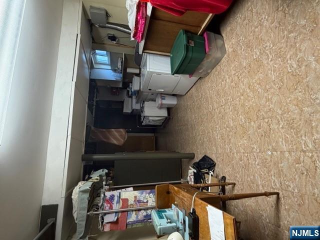 6 Patton Street Lodi, NJ 07644 - Photo 11 of 13 a room with furniture and a flat screen tv