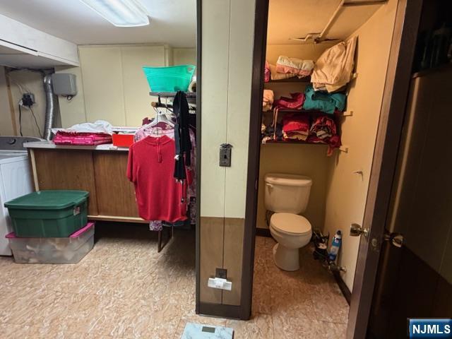 6 Patton Street Lodi, NJ 07644 - Photo 12 of 13 a bathroom with a toilet and a shower curtain